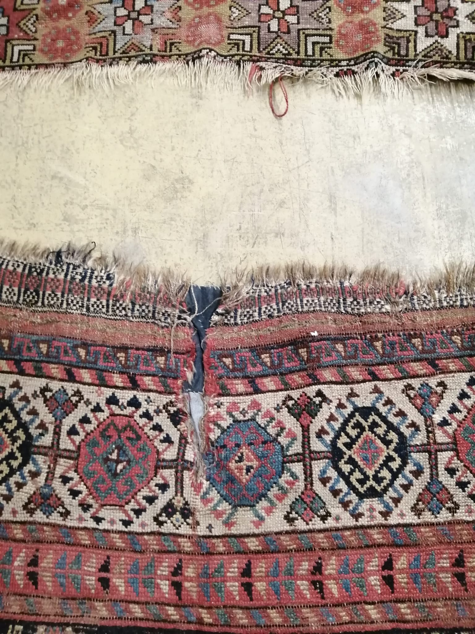 An antique Khamseh rug, 290 x 136cm